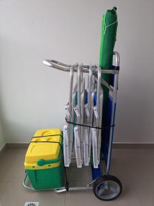 a rack full of utensils in a refrigerator at Apartamento Novo e Confortável in Itapema