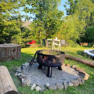 a fire pit in the middle of a yard at Homestead House, Fort Augustus in Fort Augustus