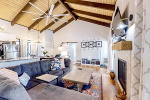 a living room with a couch and a table at Sway of the Pines, Unit#32A in Indian Pine