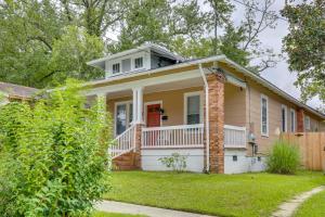 a yellow house with a red door at Downtown Wilmington Studio - Pets Welcome! in Wilmington