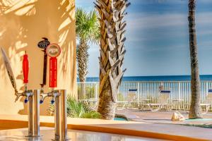 a view of the beach from a resort with chairs at Splash Beach Resort by Panhandle Getaways in Panama City Beach