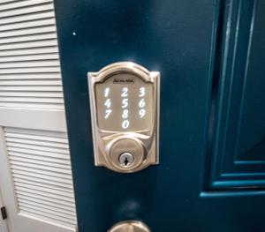 a door with an alarm clock on it at The Josi:Elegant space and view in Washington, D.C.