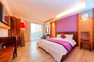 Postel nebo postele na pokoji v ubytování Seasons Bali Fashion Inn