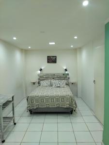 a bedroom with a bed in a white room at DAP 2 in Río Gallegos