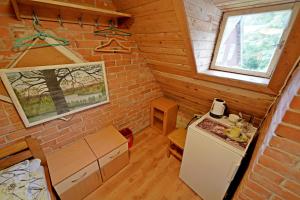 a small kitchen in a tiny house at Skruzdėlynas in Nida +14 photos