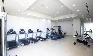 a gym with rows of treadmills and elliptical machines at The Vistana Eko Pearl Towers Apartment in Lagos