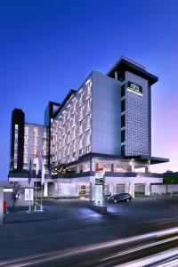 a rendering of a hotel with a parking lot at Hotel Neo Malioboro by ASTON in Yogyakarta