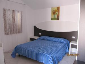 Posteľ alebo postele v izbe v ubytovaní Residence Olbia