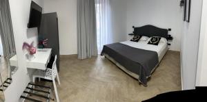 Postel nebo postele na pokoji v ubytování Hotel Barbato