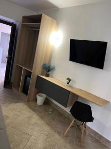TV a/nebo společenská místnost v ubytování Hotel Barbato