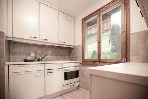 Kuchyň nebo kuchyňský kout v ubytování INN JOY Apartments - Flumserberg mit Bergpanorama + 21 fotografií