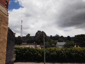 a view of a city with a radio tower at Apartamento El Rosal Cundinamarca in El Rosal