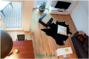 a living room with a cat cut out of the floor at Ney3 in Norderney