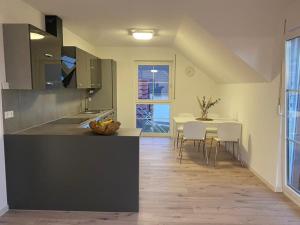 a kitchen with a table and a dining room at Ferienwohnung Vogelsang in Laufenburg