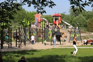 a group of people playing at a playground at Baron Apartments Orientarium,Aquapark Fala & Park in Łódź