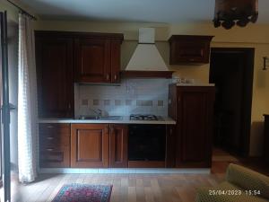 Kuchyň nebo kuchyňský kout v ubytování Garnì Astoria Hotel & SPA