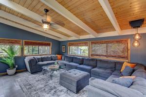 a living room with a couch and a table at Halehikiola home in Volcano