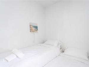 Łóżko lub łóżka w pokoju w obiekcie Live Tata Casa con jardin y vistas