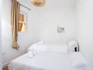 Łóżko lub łóżka w pokoju w obiekcie Live Tata Casa con jardin y vistas