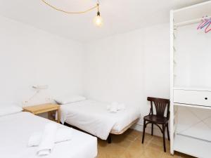 Łóżko lub łóżka w pokoju w obiekcie Live Tata Casa con jardin y vistas