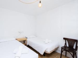 Łóżko lub łóżka w pokoju w obiekcie Live Tata Casa con jardin y vistas
