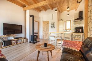 a living room with a couch and a table at Apartmány pod Janovským vŕškom in Plavecký Svätý Mikuláš