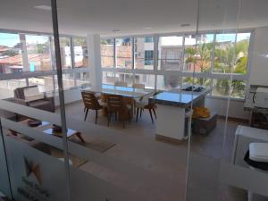 a view of a room with a table and chairs at Vista mar no ultimo andar! in Ilhéus