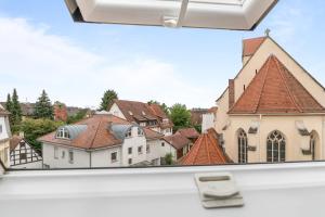 a view of a town from inside a bus at home2stay Apartments für Monteure in Wendlingen Kitchen,Wifi,Smart TV NEW in Wendlingen am Neckar