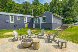 a patio with chairs and a table and a house at 13 The Eero Room - A PMI Scenic City Vacation Rental in Chattanooga