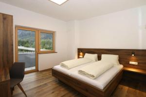 Krevet ili kreveti u jedinici u okviru objekta Apartment in Aschau at the lake