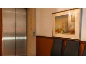 a room with a painting of fruit on the wall at ＨＯＴＥＬ ＰＯＳＨ - Vacation STAY 55608v in Odawara