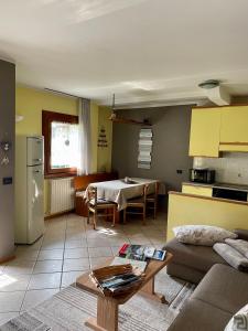 a living room with a couch and a table at Casa Federica in Valdidentro