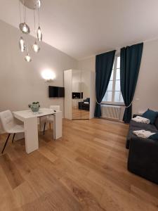 a living room with a couch and a table at La dimora dei Rolli in Genoa