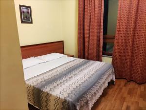 Postel nebo postele na pokoji v ubytování Hotel PALAS