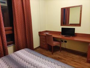 TV a/nebo společenská místnost v ubytování Hotel PALAS
