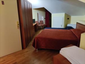 Postel nebo postele na pokoji v ubytování Hotel PALAS
