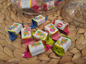a bunch of candy wrappers on a table at La dimora dei Rolli in Genoa