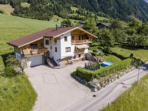 an aerial view of a house in a field at Apartment with panoramic view in Ramsau