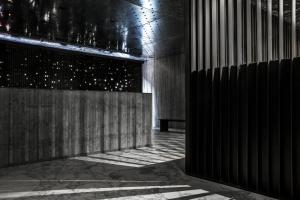 a hallway with a bench in a building at TUVE Hotel in Hong Kong