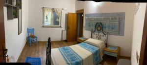 Postel nebo postele na pokoji v ubytování AZIENDA AGRITURISTICA S'ARGALASI - B&B - AFFITTACAMERE Loc S'Argalasi Austis