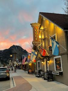 a building with a sign on the side of a street at Frisco Lodge in Frisco