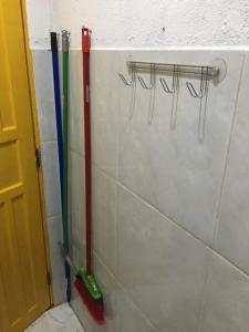 a bathroom with some tools on the wall at CARAÍVA House in Caraíva