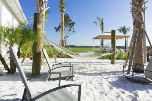 a hammock on the beach with palm trees at Dream Apartment at Storey Lake SL47311 in Kissimmee