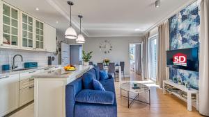 Η κουζίνα ή μικρή κουζίνα στο Apartament BlueSky - 5D Apartamenty +12 φωτογραφίες