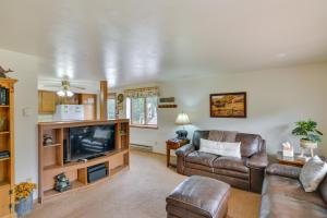 a living room with a couch and a television at Bright Ranch-Style Retreat in Downtown Buena Vista in Buena Vista
