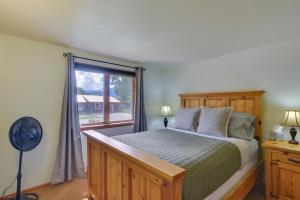 a bedroom with a large bed and a window at Bright Ranch-Style Retreat in Downtown Buena Vista in Buena Vista