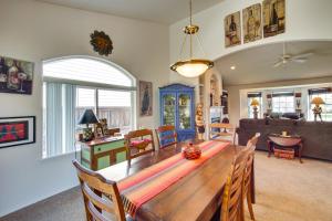 a dining room and living room with a wooden table at Central Washington Home about 6 Mi to Downtown Yakima in Yakima