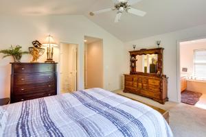 a bedroom with a bed and a dresser and a mirror at Central Washington Home about 6 Mi to Downtown Yakima in Yakima