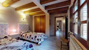 Posteľ alebo postele v izbe v ubytovaní Casa rural El Veredero