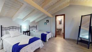 Posteľ alebo postele v izbe v ubytovaní Casa rural El Veredero